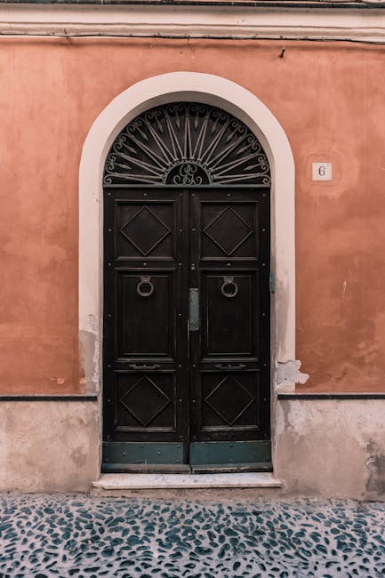 Black arched door number 6