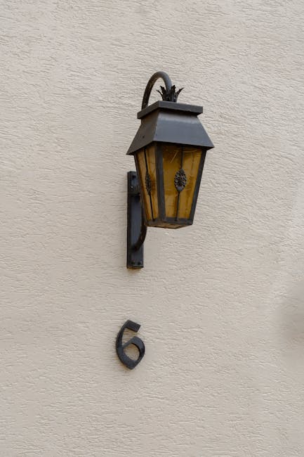 A classic wall lamp lighting up the number 6, representing 24/7 support and guidance